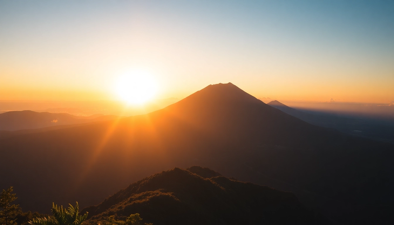 Climber overlooking the towering summit of Mt. Rinjani with lush forests below, showcasing Indonesia's iconic volcano from a scenic viewpoint.